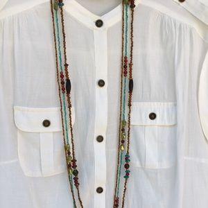 Three strand 21 inch beaded necklace. Multi color.